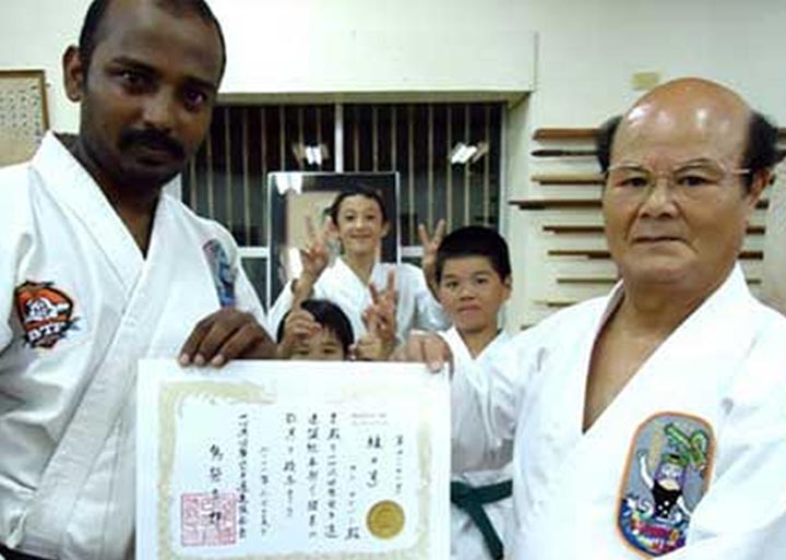 Sensei Ayyappan receiving his Renshi grade certificate